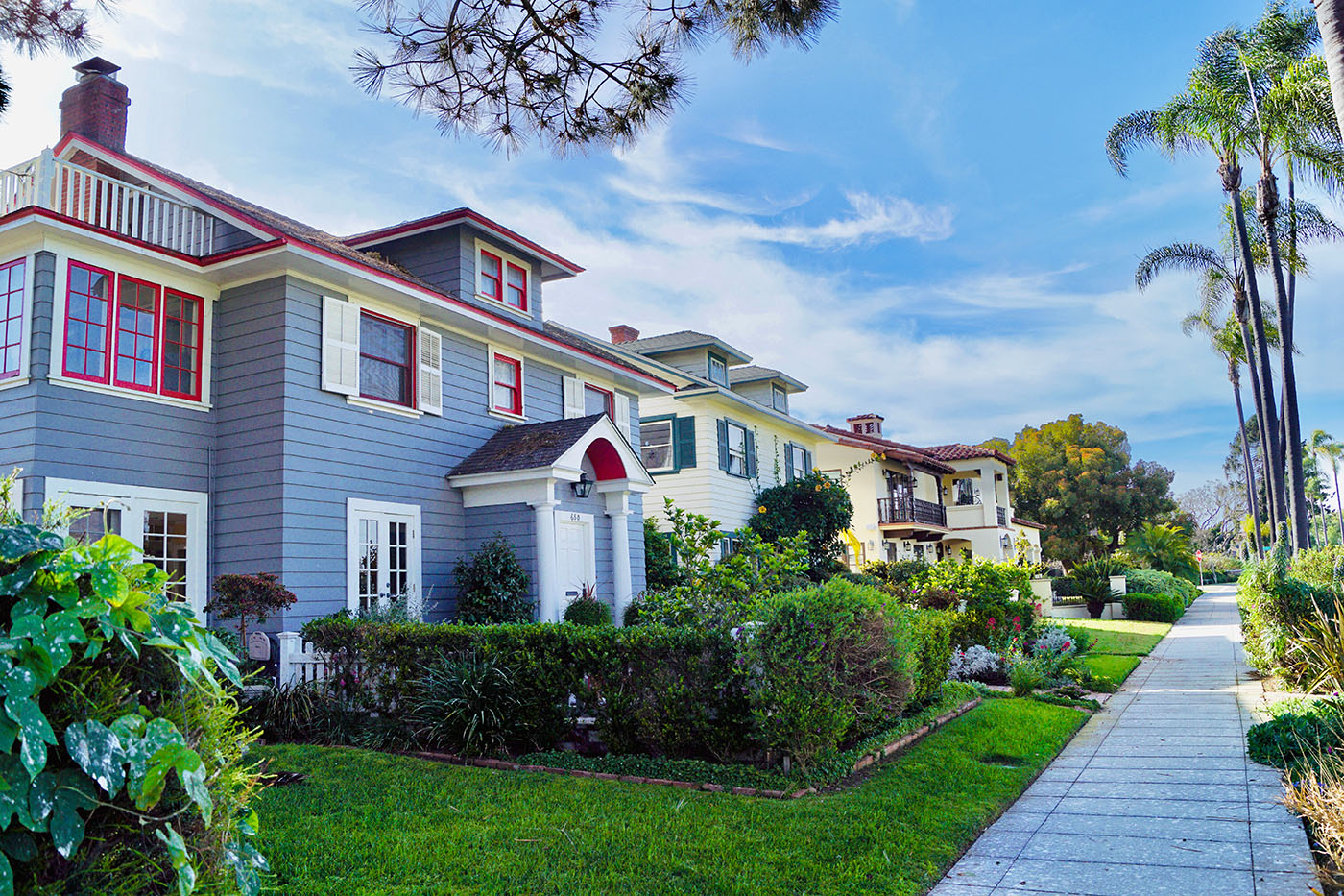 Gray American home with contrasting red and white exterior trim